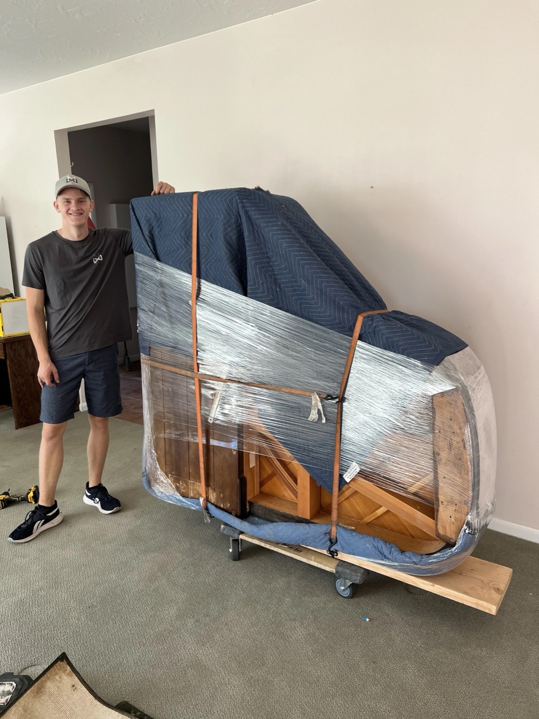 Grand piano wrapped on a piano board